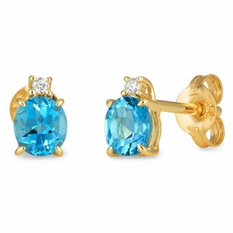 9K Yellow Gold Stud Earrings 2Xblue Topaz 5X4.5Mm Oval Claw Dia 1=.015Ct App. Si3 Jkl Claw Set